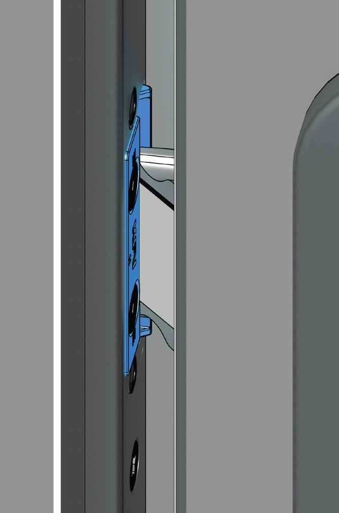 Podczas domykania drzwi zapadka zatrzaskuje się w części wymiennej-at [2].