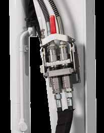 hydraulicznemu mechanizmowi blokującemu (zapobiega przypadkowemu otwarciu się szybkozłącza po wymianie narzędzia)