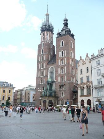 St. Mary's Basilica Kościół Mariacki St. Mary's Basilica is a brick Gothic church rebuilt in the 14th century (originally built in the early 13th century), adjacent to the Main Market Square.