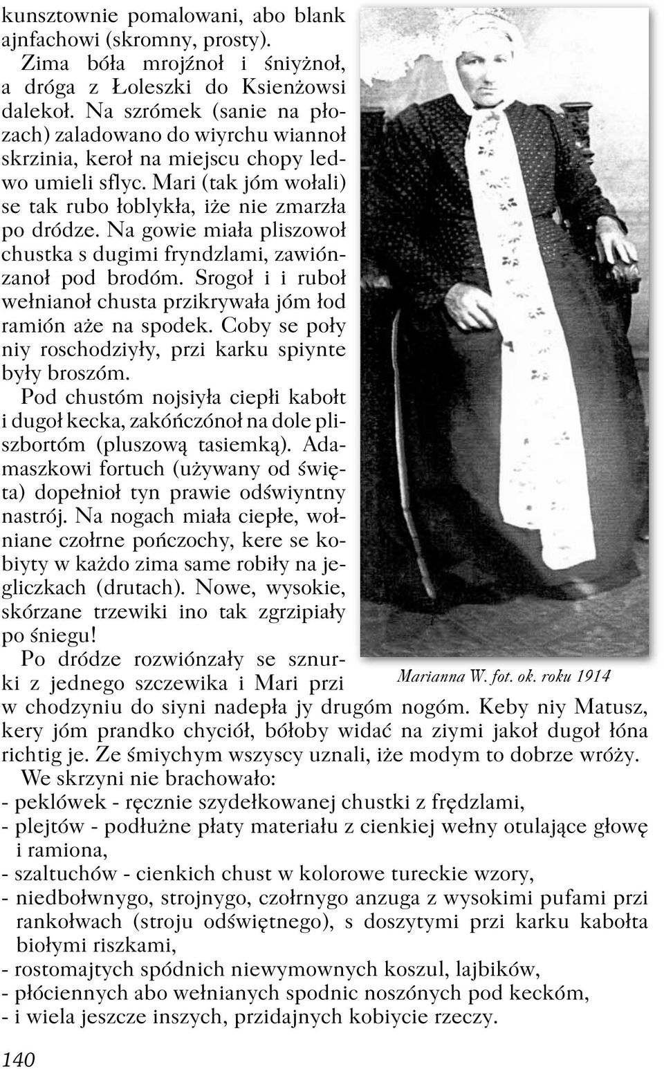 Na gowie miała pliszowoł chustka s dugimi fryndzlami, zawiónzanoł pod brodóm. Srogoł i i ruboł wełnianoł chusta przikrywała jóm łod ramión aże na spodek.