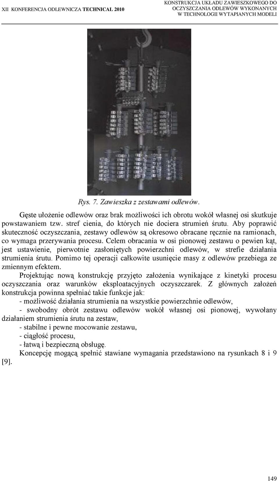 Celem obracania w osi pionowej zestawu o pewien kąt, jest ustawienie, pierwotnie zasłoniętych powierzchni odlewów, w strefie działania strumienia śrutu.