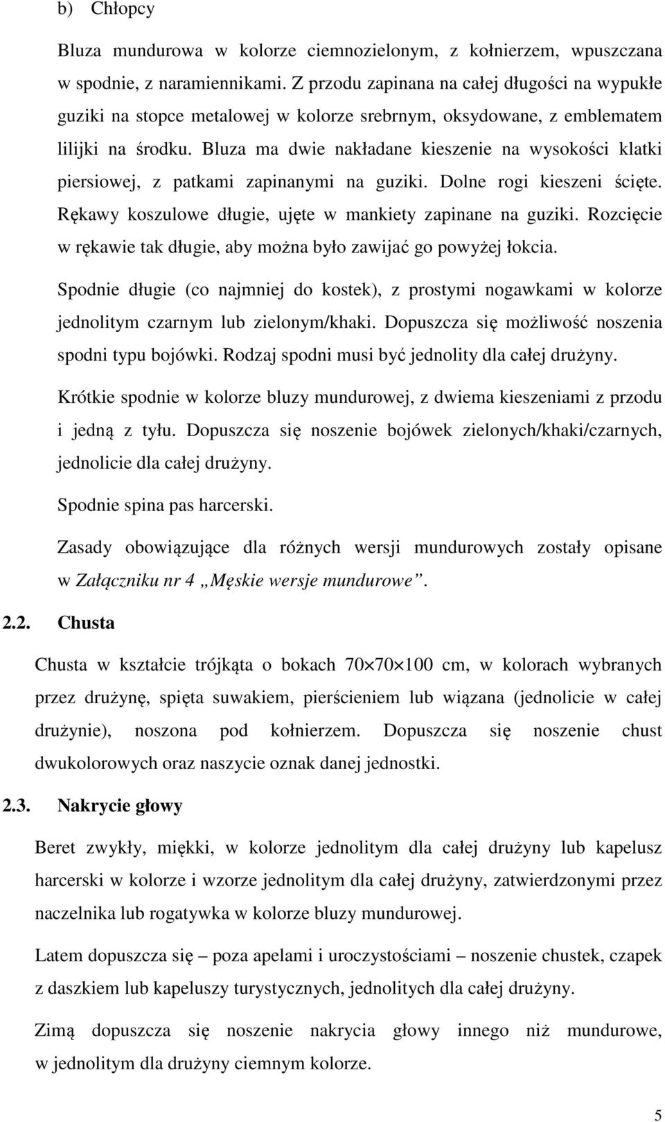 Bluza ma dwie nakładane kieszenie na wysokości klatki piersiowej, z patkami zapinanymi na guziki. Dolne rogi kieszeni ścięte. Rękawy koszulowe długie, ujęte w mankiety zapinane na guziki.