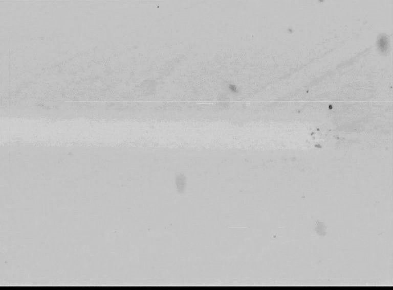 Scratch tracks of a-si:c:h/mono-si, a) abrasion wear in scratch track (at 5 N), b) cracks of the substrate and fracture of the layer (L C2 = 15 N) Warstwa a-si:c:h na