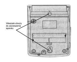 V. Montaż aparatu w pozycji wiszącej V. Montaż aparatu w pozycji wiszącej Aparat można zawiesić na przykład na ścianie. Do tego celu służą dwa otwory- wieszaki umieszczone w podstawie aparatu.