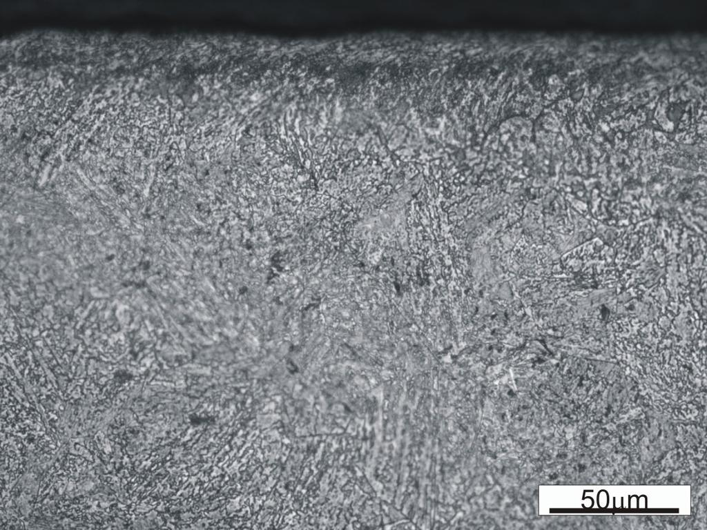 Rys. 5. Morphology of the near-to-surface layer of specimens made of the tested bainitic steel (after a tribological test).