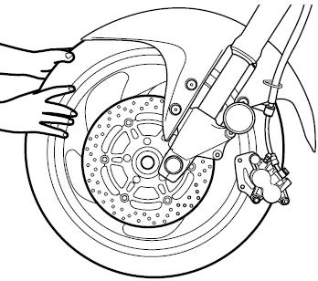 4. Umieść pod wahaczem akcesoryjną podstawkę serwisową, tak, by zapewnić stabilne ustawienie motocykla.
