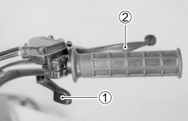 Prawy uchwyt kierownicy Dźwignia gazu (1) Prędkość silnika jest uzależniona od pozycji, w której znajduje się dźwignia gazu.