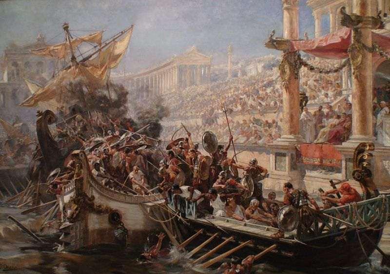 NAUMACHIA Naumachia (wojna morska) to widowisko przedstawiające bitwę morską organizowane w amfiteatrze w starożytnym Rzymie, po wypełnieniu areny wodą.