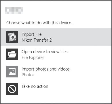 1 W obszarze Import pictures and videos (Importuj obrazy i wideo) kliknij przycisk Change program (Zmień program). Zostanie wyświetlone okno dialogowe wyboru programu.