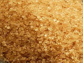 Surowy cukier trzcinowy Częściowo oczyszczona sacharoza, wykrystalizowana z częściowo oczyszczonego soku z trzciny cukrowej bez