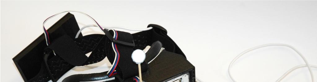 śledzenia, d) akumulator w obudowie drukowanej, e) opaska, f) czujnik orientacji AHRS, g) wentylatory, h) bezprzewodowy moduł sterujący czujnikiem orientacji, i) akumulator zapasowy