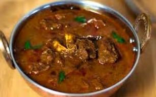 Chicken Curry Relishing Indian dish with chicken simmered in a fragrant sauce with tomato,