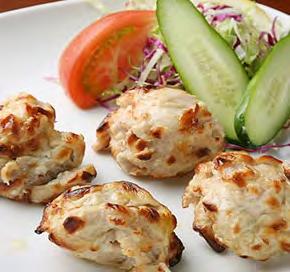 Chicken Aachari Tikka Sizzler Pieces of chicken marinated in yogurt with