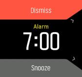 Aby ustawić stałą godzinę alarmu: 1. W widoku zegarka naciśnij środkowy przycisk w celu wyświetlenia menu skrótów i przewinięcia do Alarmy. 2. Najpierw wybierz, jak często alarm ma się włączać.