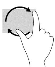 Umieść dwa rozsunięte palce na obszarze płytki dotykowej TouchPad. Przesuń oba palce ruchem łukowym przy jednoczesnym zachowaniu ich stałej odległości.