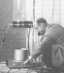 Pound, stationed at the top of a tower in a Harvard physics building (top), communicated