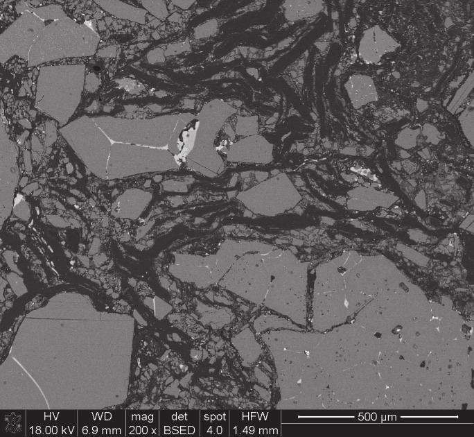 A photograph of microstructure of the tested product in working side with slug after melting processes. Rys. 12.
