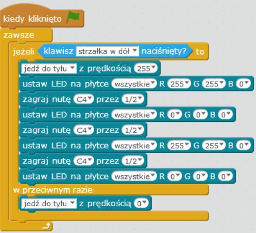 Program zaprezentowany na powyższym rysunku włącza sygnalizację świetlną i dźwiękową robota podczas jego cofania.