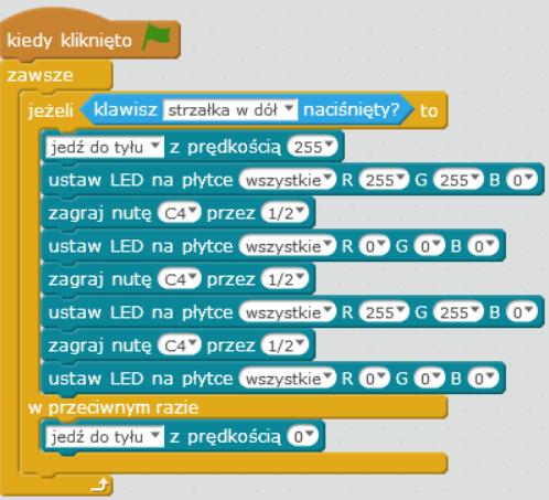 Program zaprezentowany na powyższym rysunku włącza sygnalizację świetlną i dźwiękową robota podczas jego cofania.