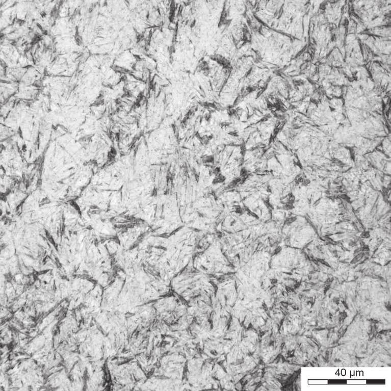 eld (950 C) to temperature of isothermal transformation followed by holding at this temperature during 100 hours: a) Ti = 185 C, optical microscopy; b) Ti = 185 C, SEM plates or packets of laths of