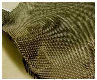 Zdjęcie (Rys. 19) przedstawia przykład typowej tkaniny z włókna węglowego, produkowanej przeważnie na potrzeby przemysłu lotniczego. Rys.