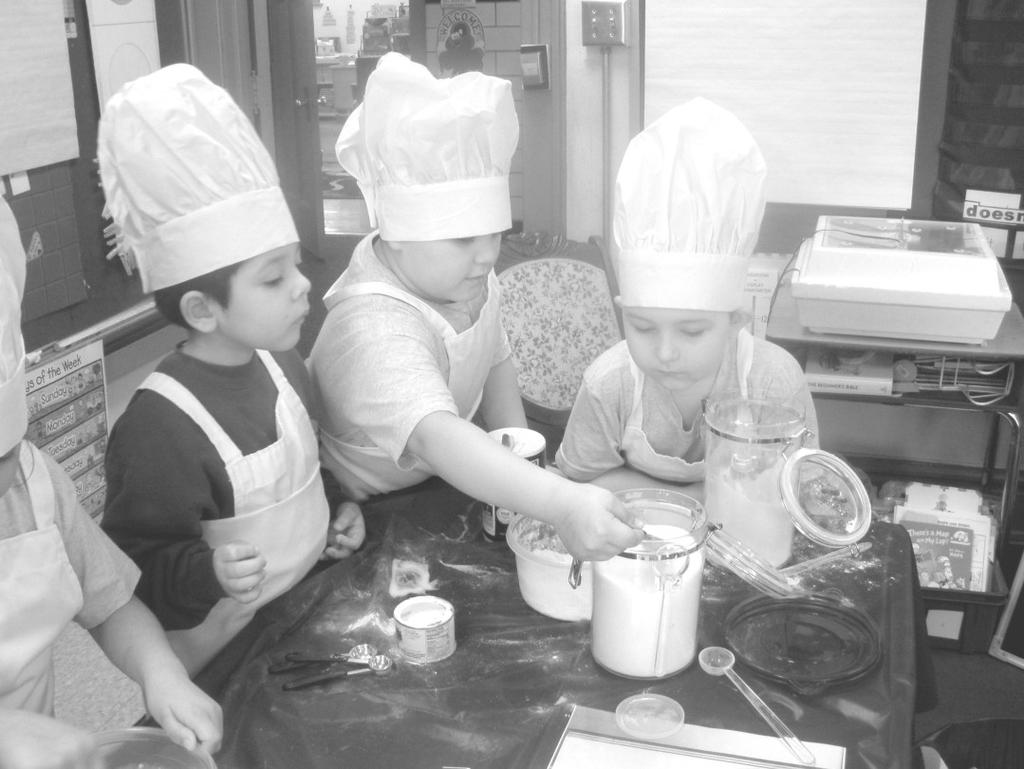 After a quick cleanup, the pancakes were fried. Last, and best of all, the class enjoyed eating the fruits of their labor. The First Grade students all agreed they were GREAT cooks. Ms.