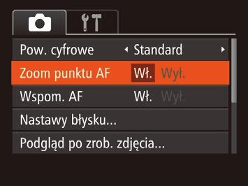 Pomocne funkcje Powiększanie obszaru, na którym jest ustawiona ostrość Filmy Wyświetlanie linii siatki Linie siatki wyświetlane na ekranie służą w fotografowaniu jako linie odniesienia w pionie i w