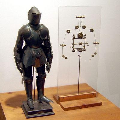 Historia Robotyki - 1495 Mechaniczny rycerz w zbroi - Leonardo da Vinci W średniowieczu budowano tego typu mechanizmy napędzane energią wodną, siłą