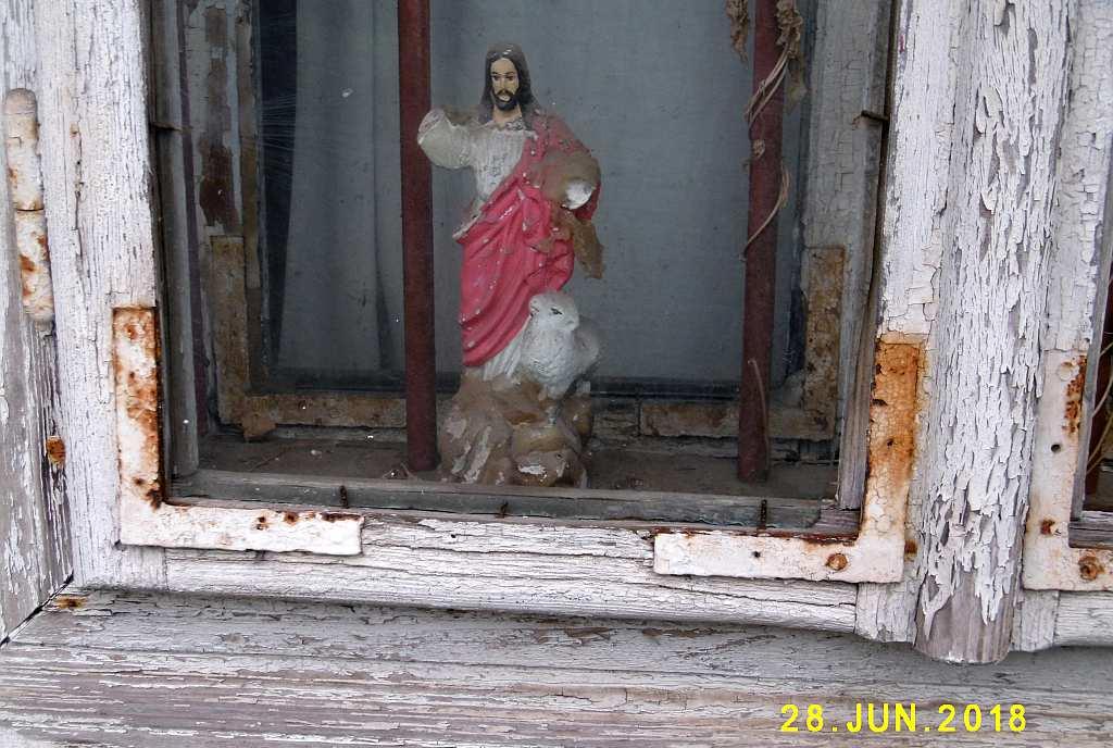 Chrystusa na parapecie okna,