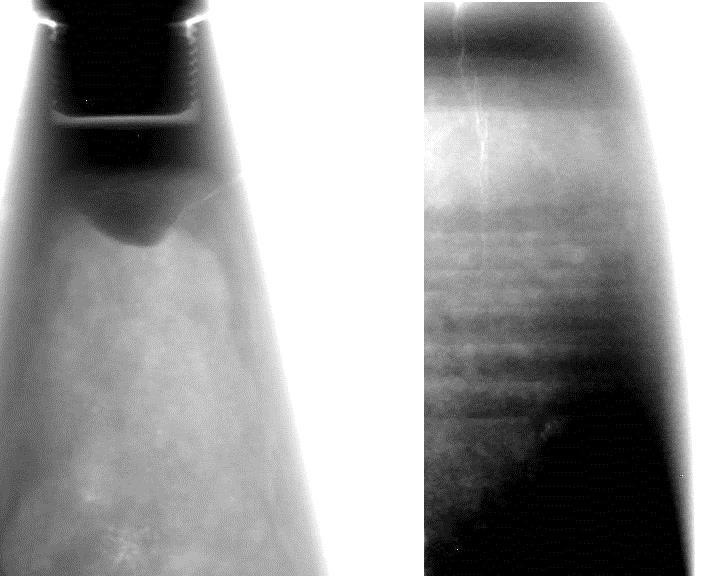 Fragments of mortar projectiles with visible cracks W wyniku interpretacji uzyskanych zdjęć, stwierdzono wady paliwa silnika marszowego w postaci odklejonego inhibitora (fot. 8).