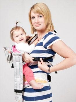 While holding your child with your right arm catch the shoulder strap on your back with your left hand and fasten it