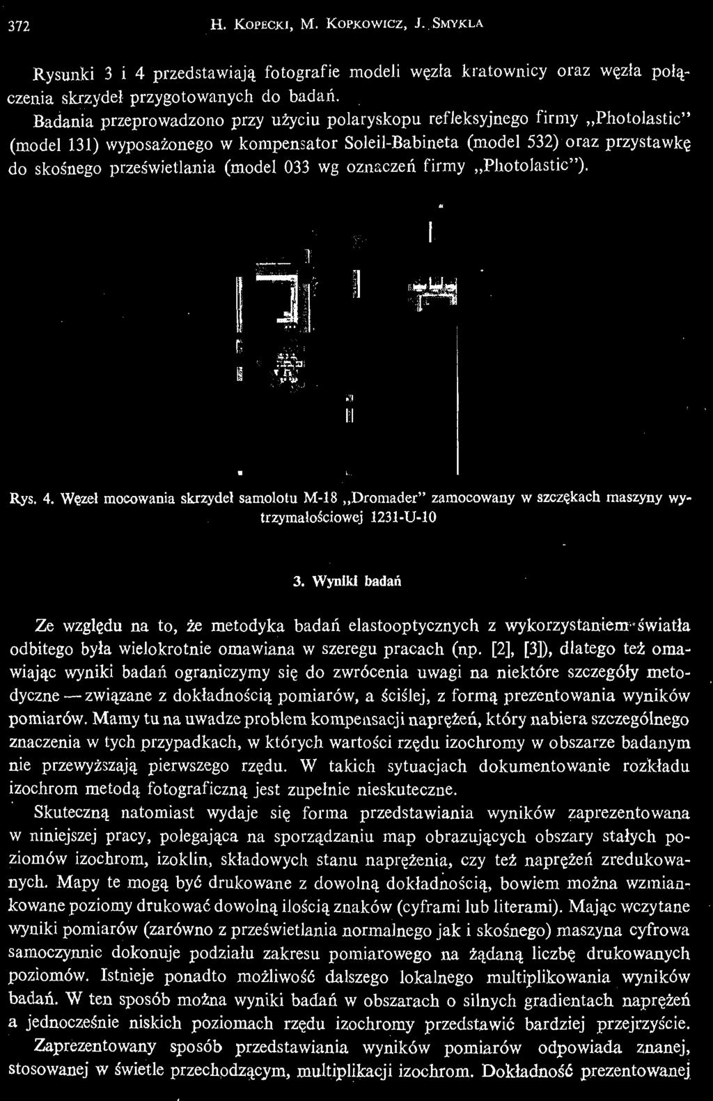 (model 033 wg oznaczeń firmy Photolastic"). Rys. 4. Wę zeł mocowania skrzydeł samolotu M- 18 Dromader" zamocowany w szczę kach maszyny wytrzymałoś ciowej 1231- U- 10 3.