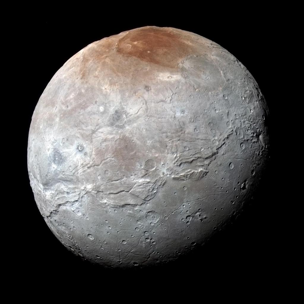 brak atmosfery powierzchnia lody H2O potężny kanion aktywne kriogejzery i kriowulkany ciemny teren Mordor, miejsce kondensacji gazów uciekających z Plutona teren