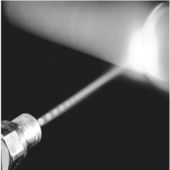 Pierwszy laser CO 2 z 1968 roku (Science Museum, Londyn) Działanie lasera: LASER (Light Amplification by the Stimulated Emission of Radiation) - Absorpcja promieniowania powoduje przejście atomu ze