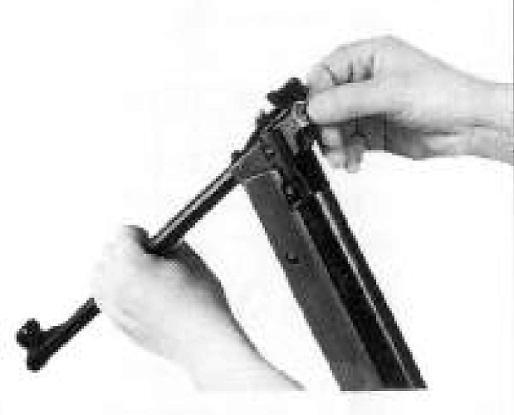 ENGLISH Hold the barrel with one hand and insert a pellet in the chamber with your other hand. Draw the barrel back to its original position.