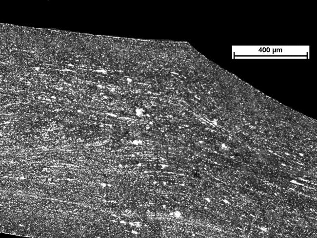 13c), where properly defined although occasionally speckled with individual new grains fibrous structure is recreated. Rys. 12.