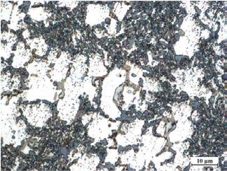Microstructure of the pressure cast made of the silumin containing chromium in the amount of: a) 0.1 wt. %; b) 0.2 wt.