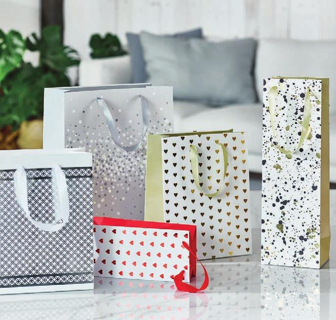 PREMIUM GIFT BAGS/ TORBY PREZENTOWE PREMIUM Classy and stylish Premium gift bags with high grammare of paper and sophisticated decorative details. Every gift they contain is to be long remembered.