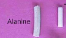 Polymer-Alanine Dosimeters (PAD) Produkowane w postaci kabelków utworzonych z proszku alaninowego (67%) zmieszanego z polimerem (33%) działającym jako substancja wiążąca. Przykład: średnica 4.