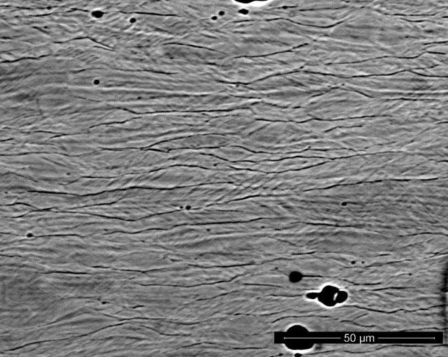 SEM microstructures for copper deformed with deformation path change: a) cross sectional direction, b)