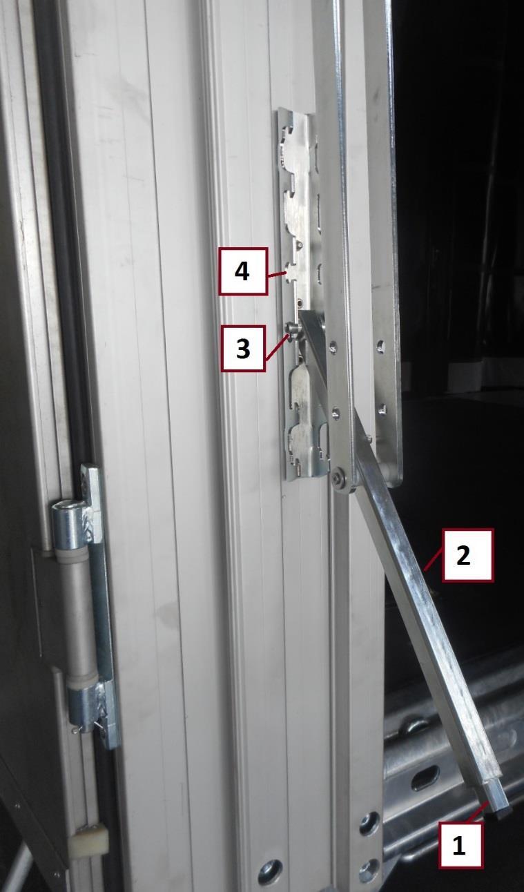 14.6. Mechaniczny system podnoszenia dachu: Podnoszenie dachu: Rozsunąć opończę i otworzyć drzwi; Wcisnąć przycisk 1 i odblokować ramię 2 pociągając je do siebie.