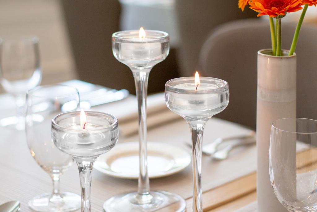 8 h. The main advantage of candles is a transparent container, thanks to which