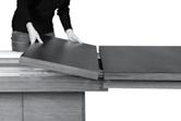 Push the table top forward. 3. Lock the safety bolts.