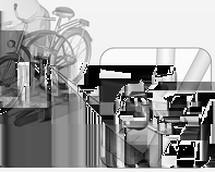 74 Schowki Zamontowanie wspornika do przewożenia rowerów 1. Obrócić pedały w położenie pokazane na ilustracji i wstawić rower w przednie uchwyty na koła. Upewnić się, że rower stoi pośrodku uchwytów.