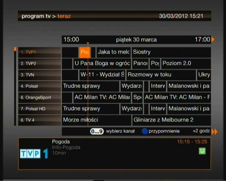 Wyszukaj interesujący Cię kanał, używając przycisków ze strzałkami Wybrany kanał i program podświetlone są na pomarańczowo. Możesz także przeskoczyć na kanał naciskając klawisze numeryczne programu.