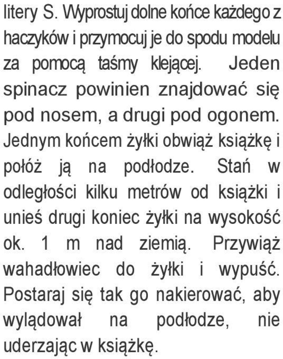 Jednym końcem żyłki obwiąż książkę i połóż ją na podłodze.