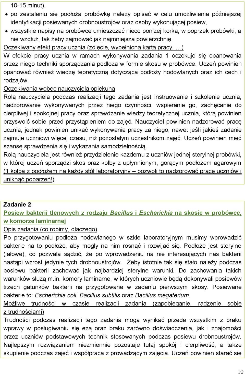 poniżej korka, w poprzek probówki, a nie wzdłuż, tak żeby zajmować jak najmniejszą powierzchnię.