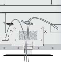 - śruba ( dostarczana razem z urządzeniem) Uchwyt do przewodów Po podłączeniu wszystkich potrzebnych przewodów zamontuj uchwyt do przewodów, jak pokazano na rysunku, a następnie zepnij kable.
