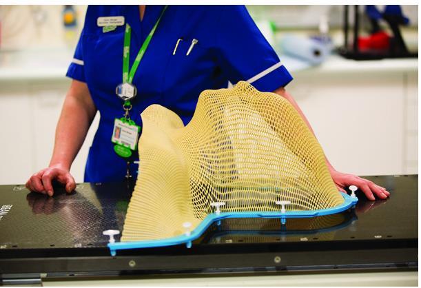 Mould You must lie very still during radiotherapy and stay in the correct position. Some people have a mould or shell to wear to keep them in position.
