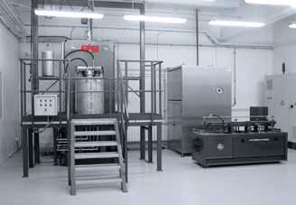 Vacuum system for desorption of contaminations: a) general view, b) a capsule during desorption, c) a closed capsule.
